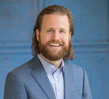 JD Hays with beard and blue suit