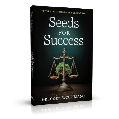 A black book cover reading "Seeds for Success: Proven Principles of Persuasion" by Gregory S. Cusimano. The cover is black and features an image of balanced scales with a tree sprouting from its base.