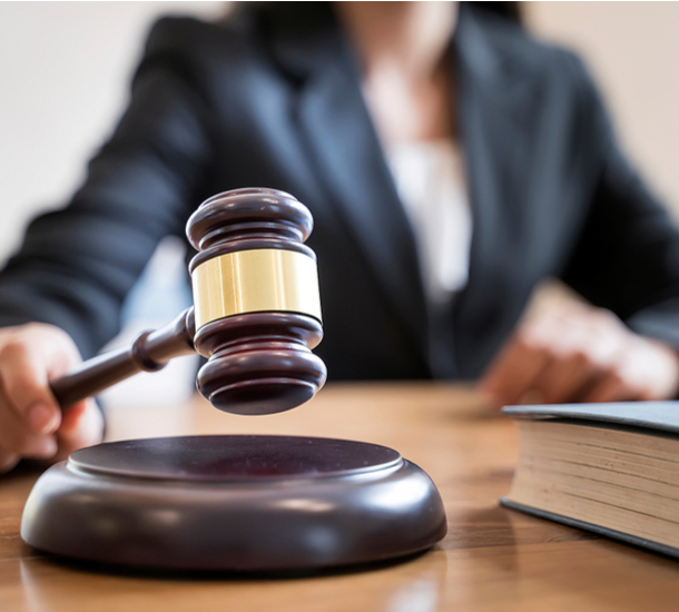 Female judge banging gavel